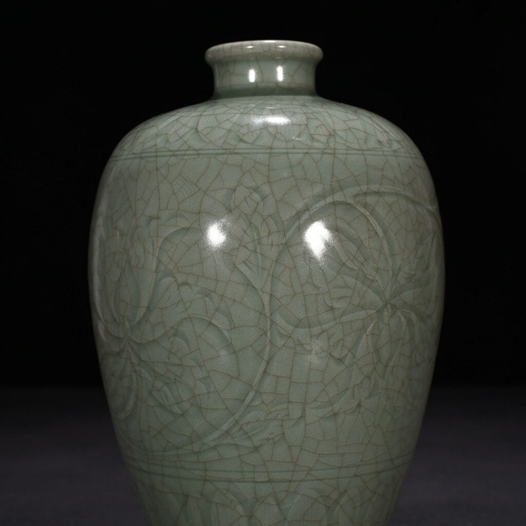 Song Dynasty Longquan kiln carved plum vase with entwining lotus pattern