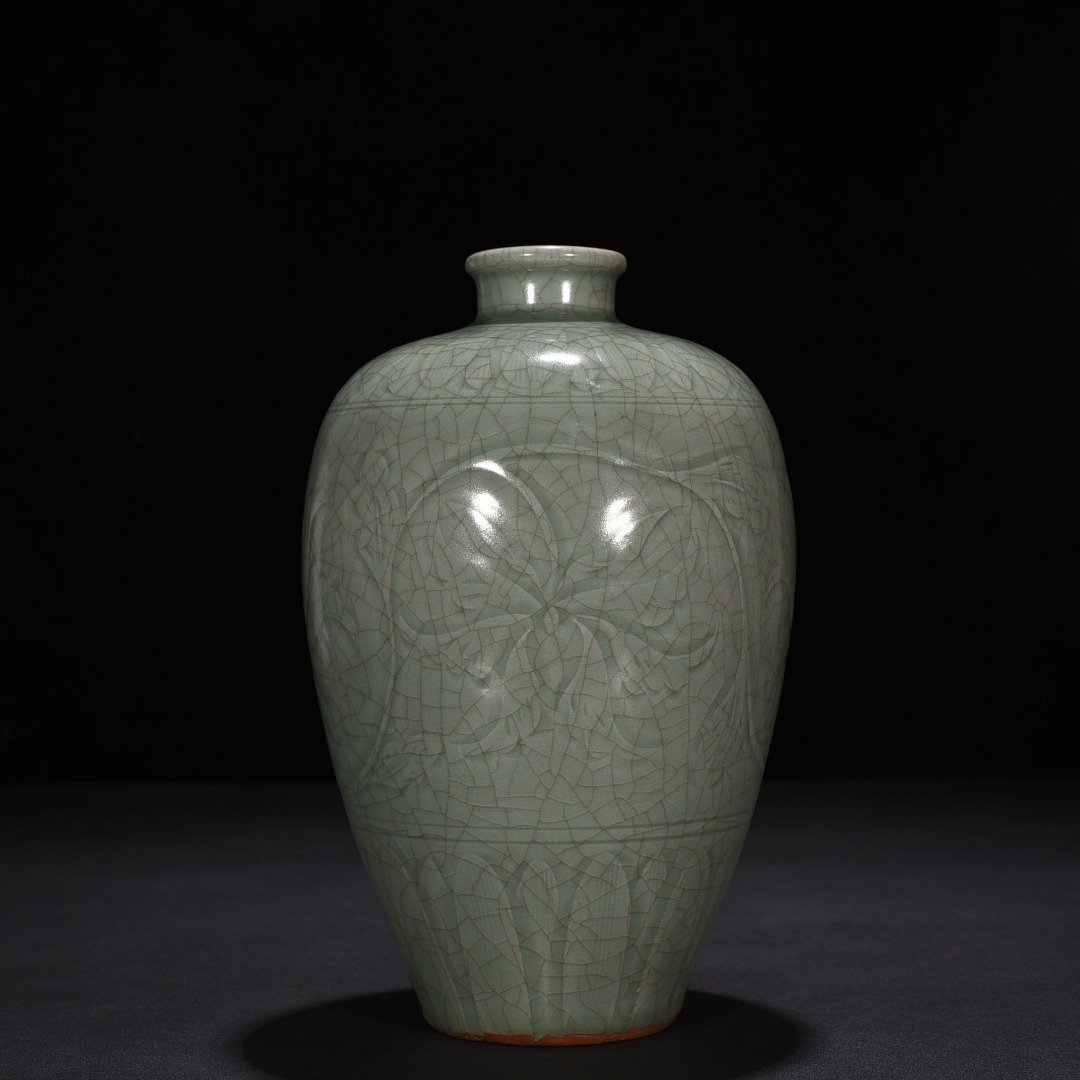 Song Dynasty Longquan kiln carved plum vase with entwining lotus pattern