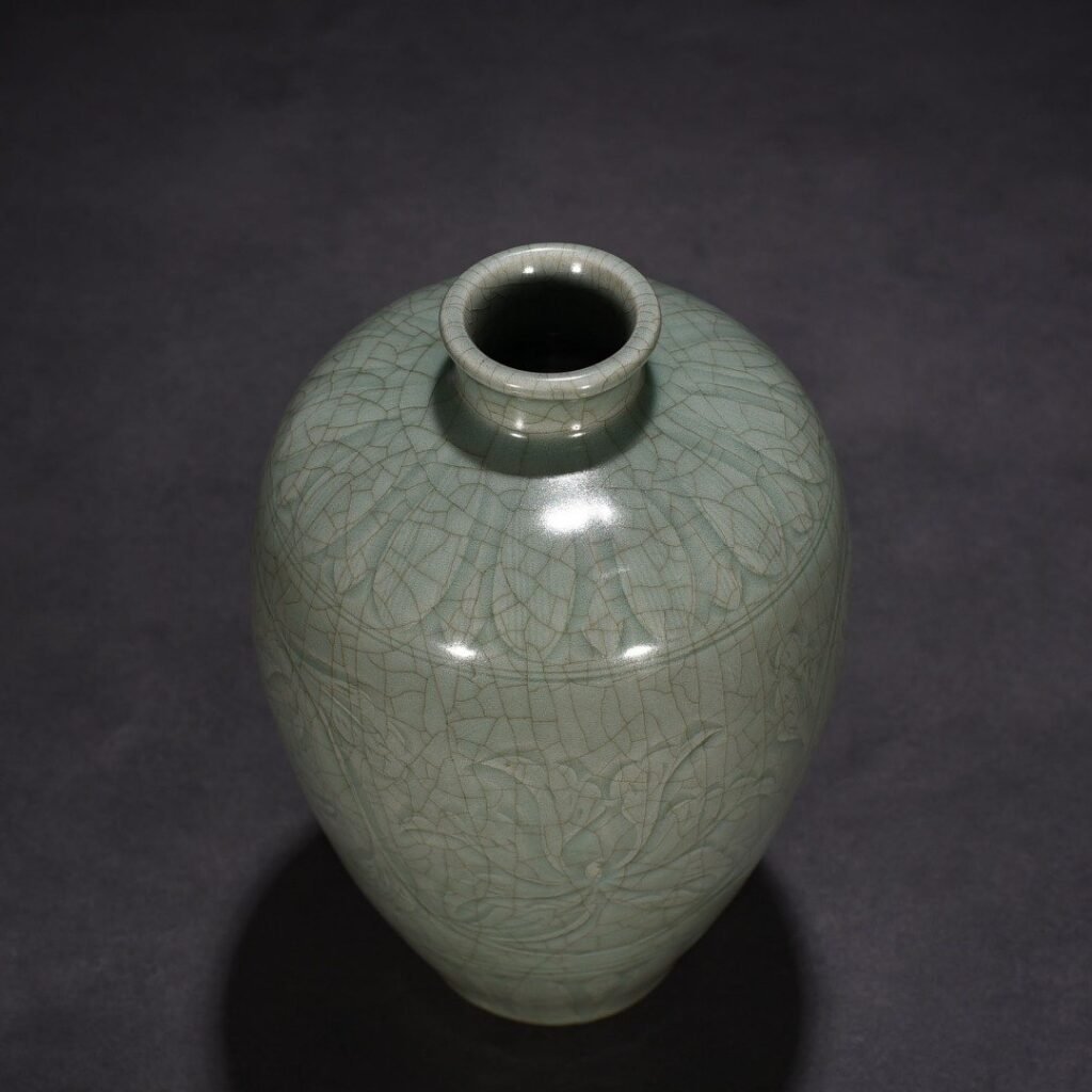 Song Dynasty Longquan kiln carved plum vase with entwining lotus pattern