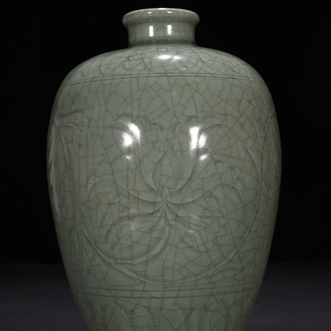 Song Dynasty Longquan kiln carved plum vase with entwining lotus pattern