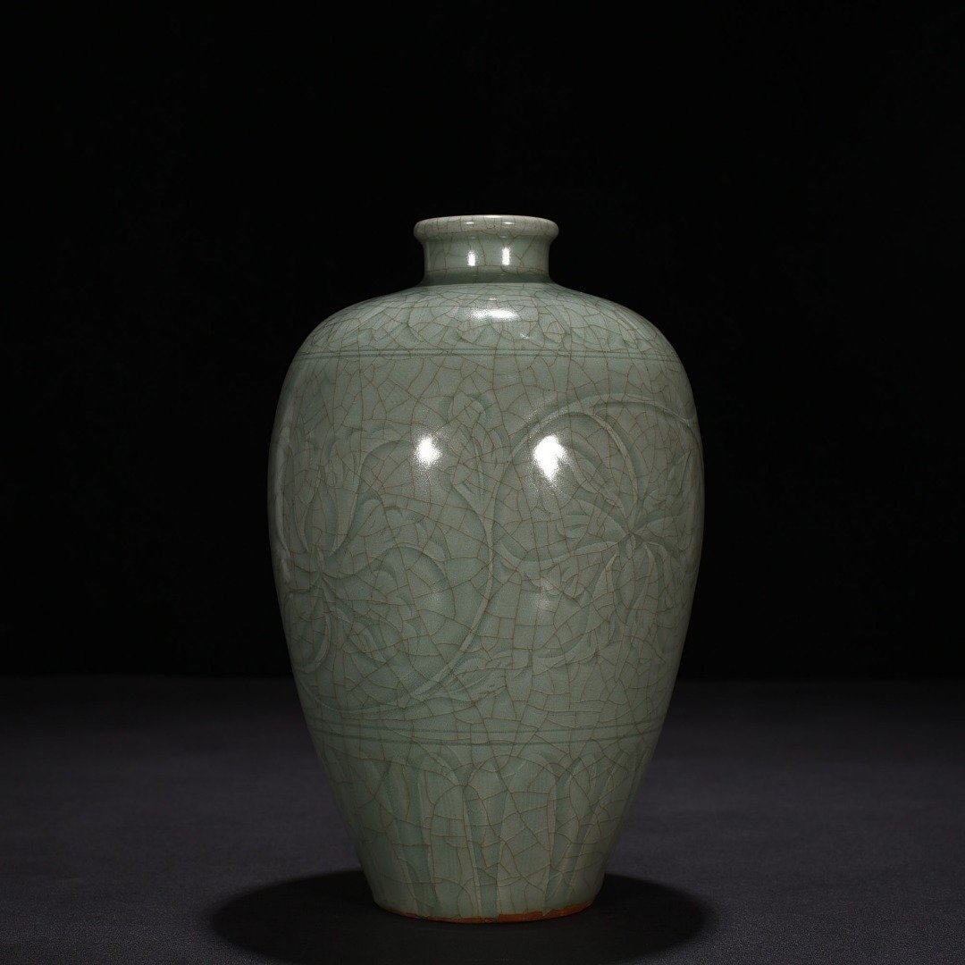 Song Dynasty Longquan kiln carved plum vase with entwining lotus pattern