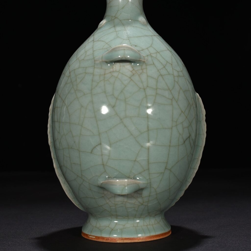 Song Dynasty Longquan kiln pink celadon glaze double fish vase