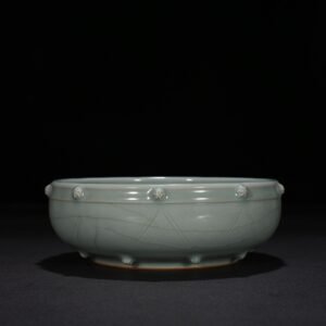 Song Dynasty Longquan kiln pink celadon glaze stacked dragon pattern drum nail wash