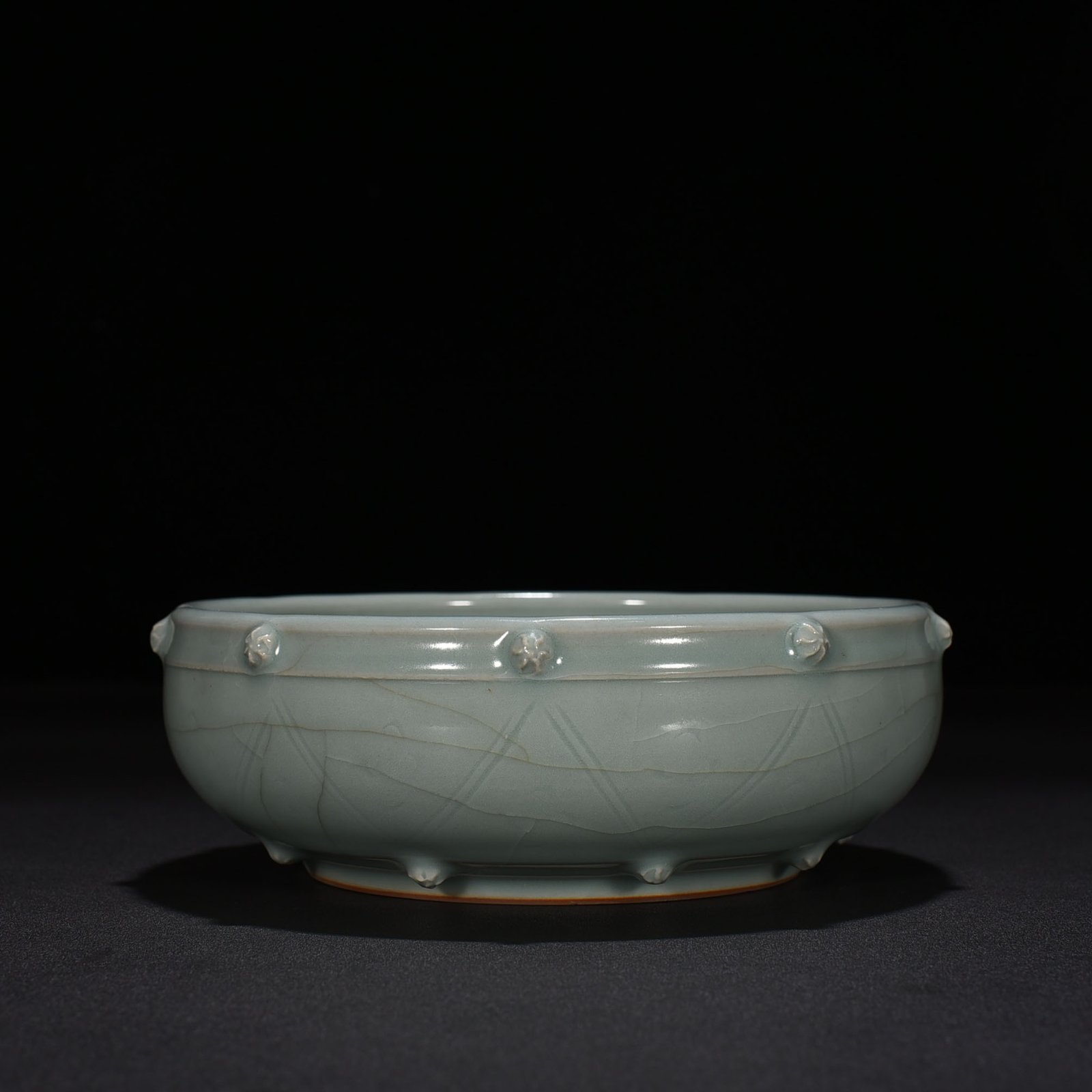 Song Dynasty Longquan kiln pink celadon glaze stacked dragon pattern drum nail wash