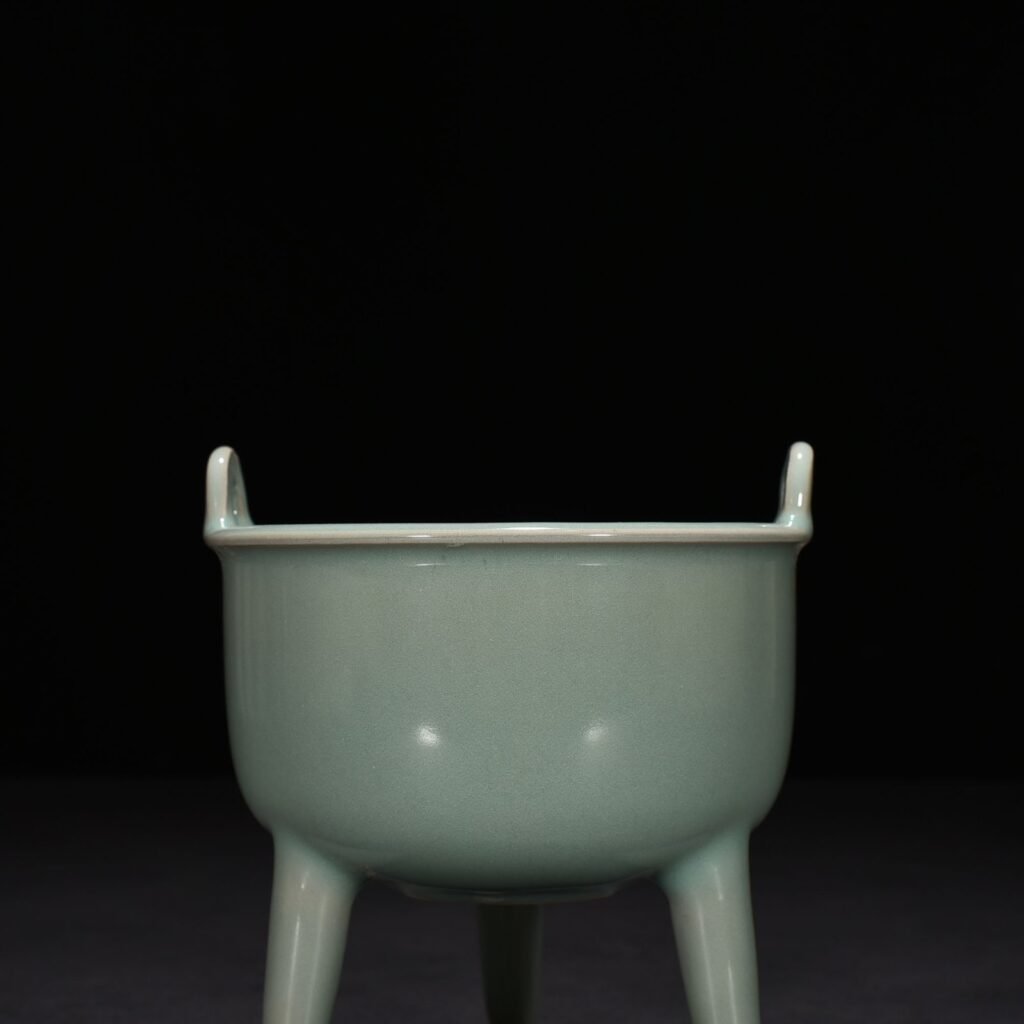 Song Dynasty Longquan kiln pink celadon glaze tube foot double ear furnace
