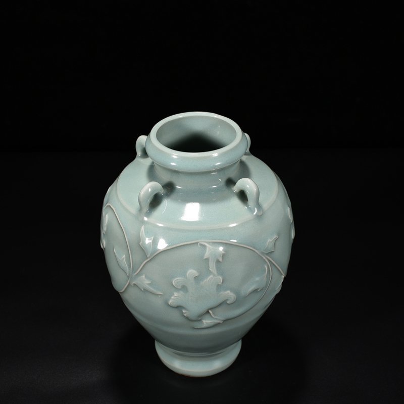 Song Dynasty Longquan kiln pink celadon glaze laminated flower pattern four-series bottle