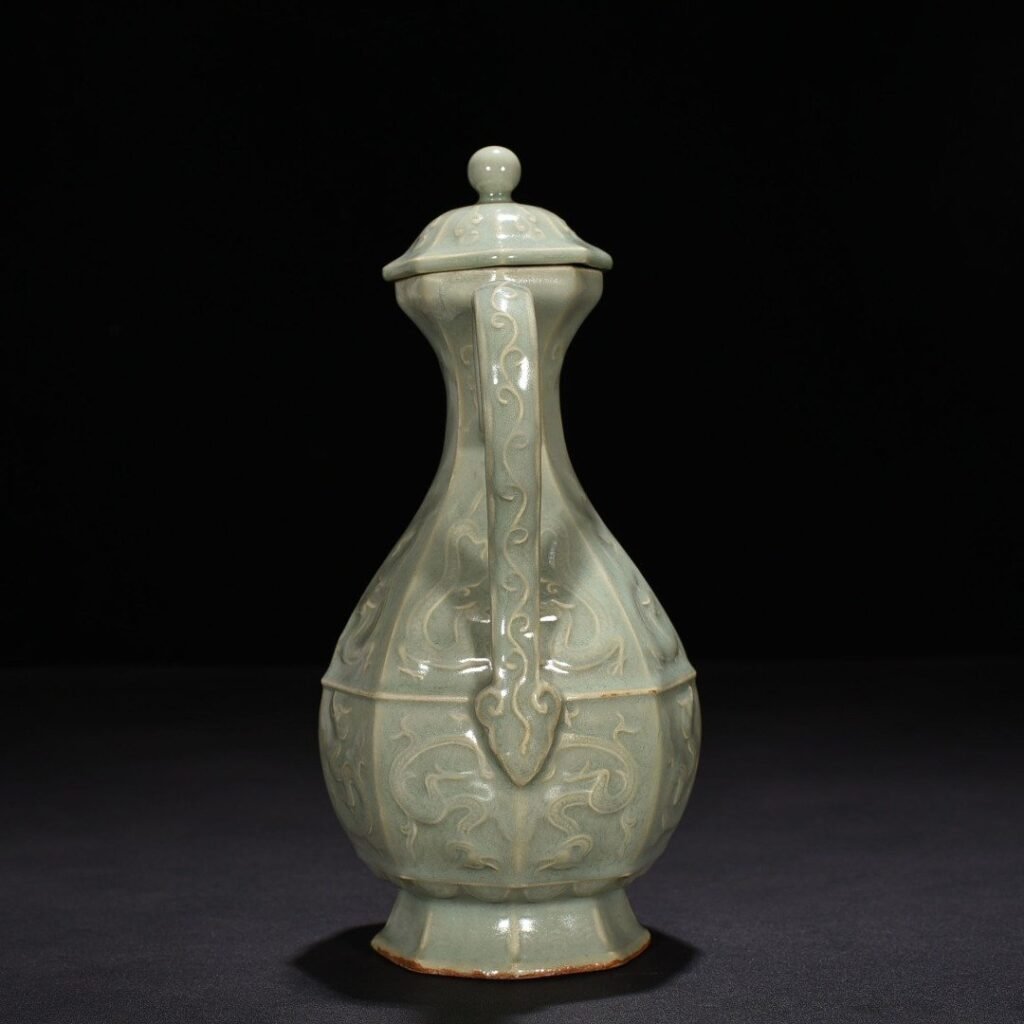 Song Dynasty Longquan kiln pink celadon glaze carved chilong pattern eight-sided ewer