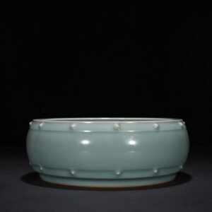 Song Dynasty Longquan kiln pink celadon glaze drum nail wash imperial inscription