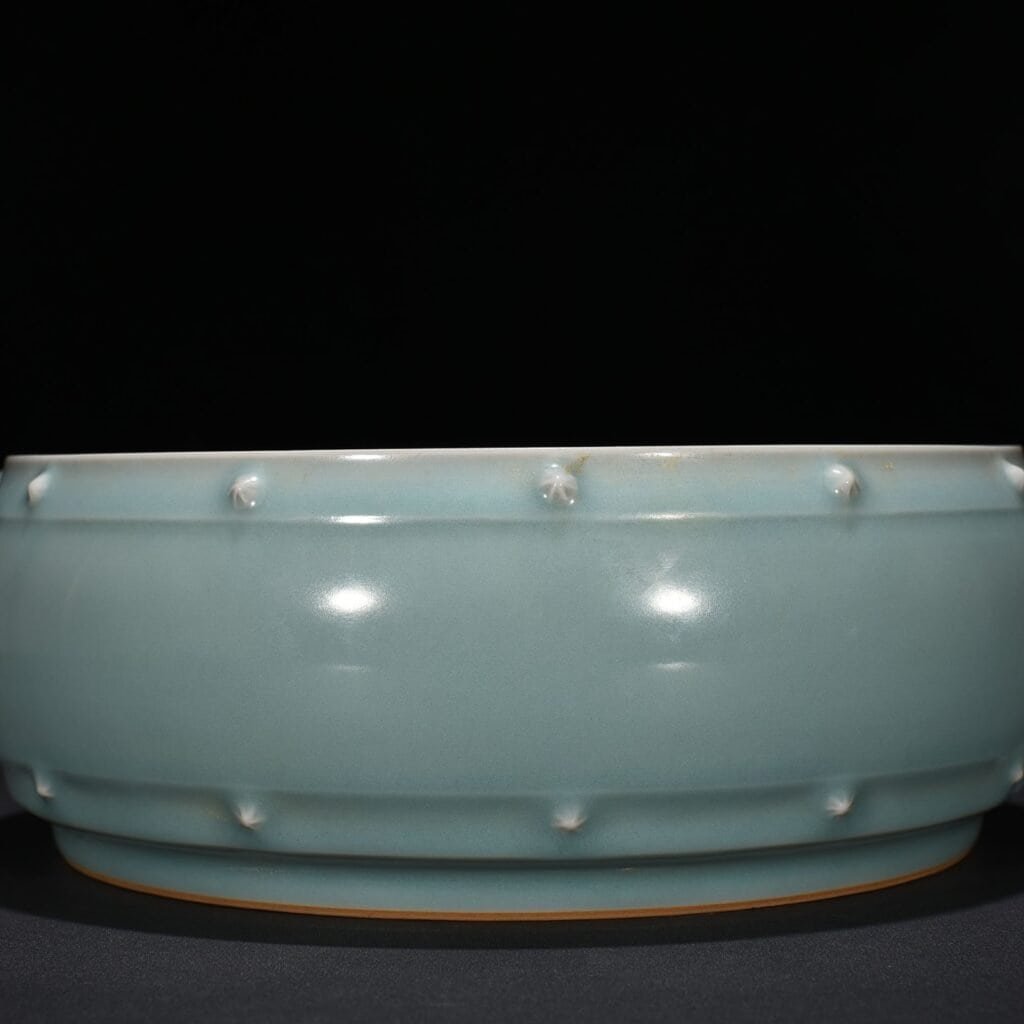 Song Dynasty Longquan kiln pink celadon glaze drum nail wash imperial inscription
