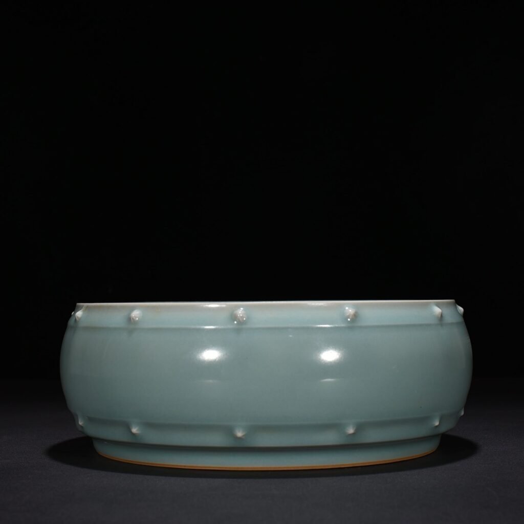 Song Dynasty Longquan kiln pink celadon glaze drum nail wash imperial inscription