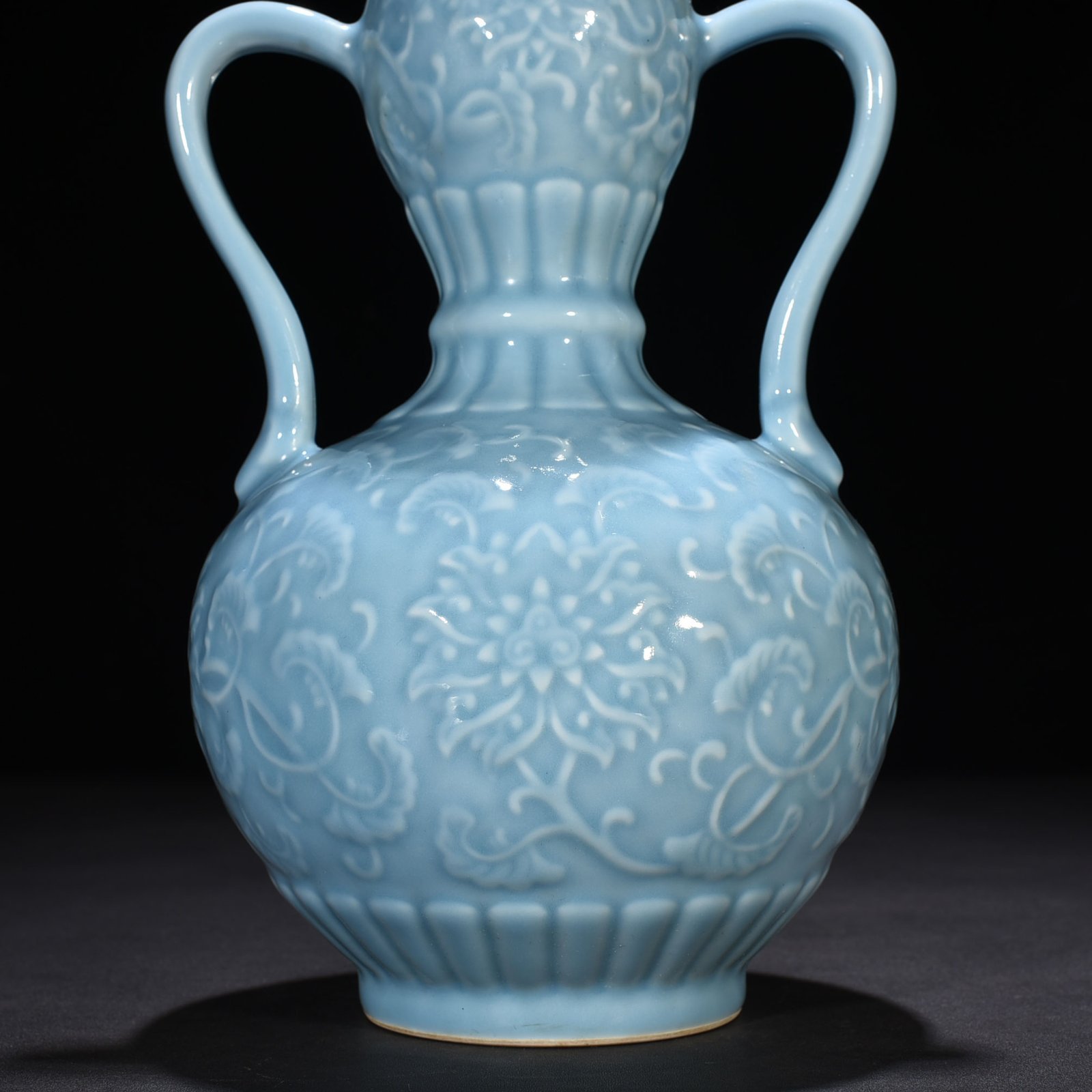 Qing Dynasty Qianlong sky blue glaze carved ruyi ear gourd vase with entwining floral pattern