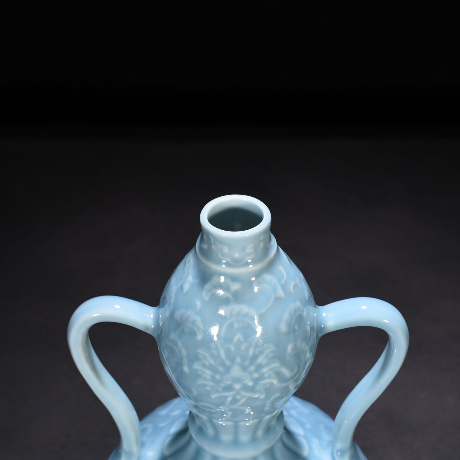Qing Dynasty Qianlong sky blue glaze carved ruyi ear gourd vase with entwining floral pattern