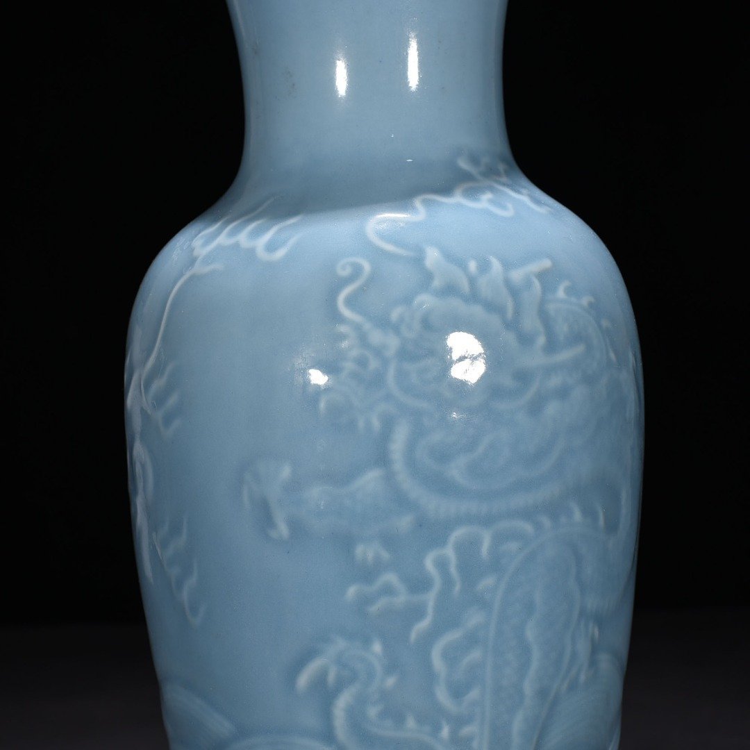 Qing Dynasty Qianlong sky blue glaze engraved dragon pattern vase