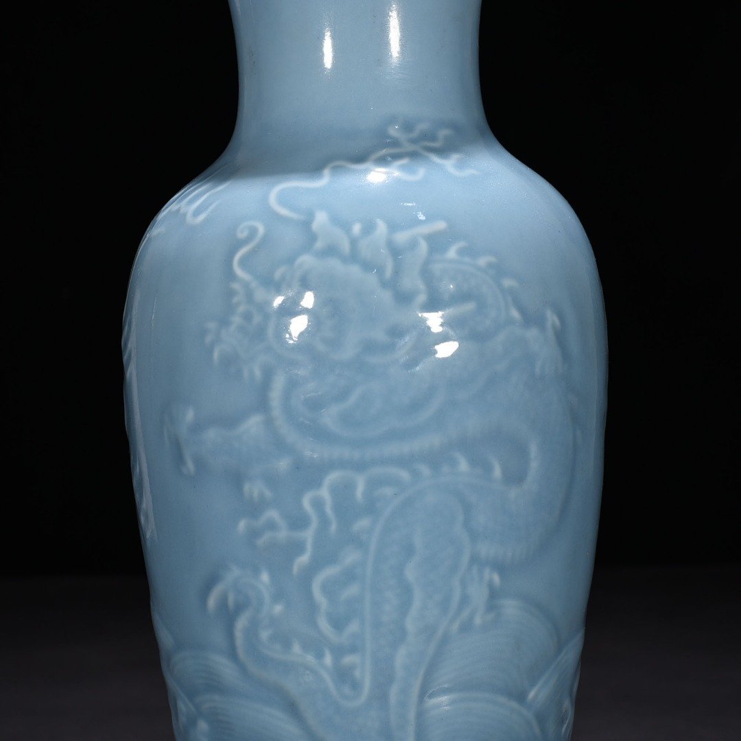 Qing Dynasty Qianlong sky blue glaze engraved dragon pattern vase