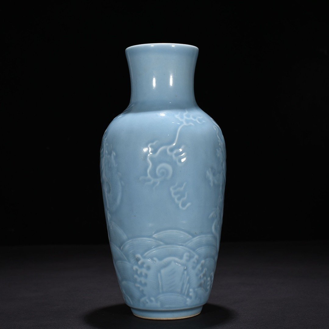 Qing Dynasty Qianlong sky blue glaze engraved dragon pattern vase