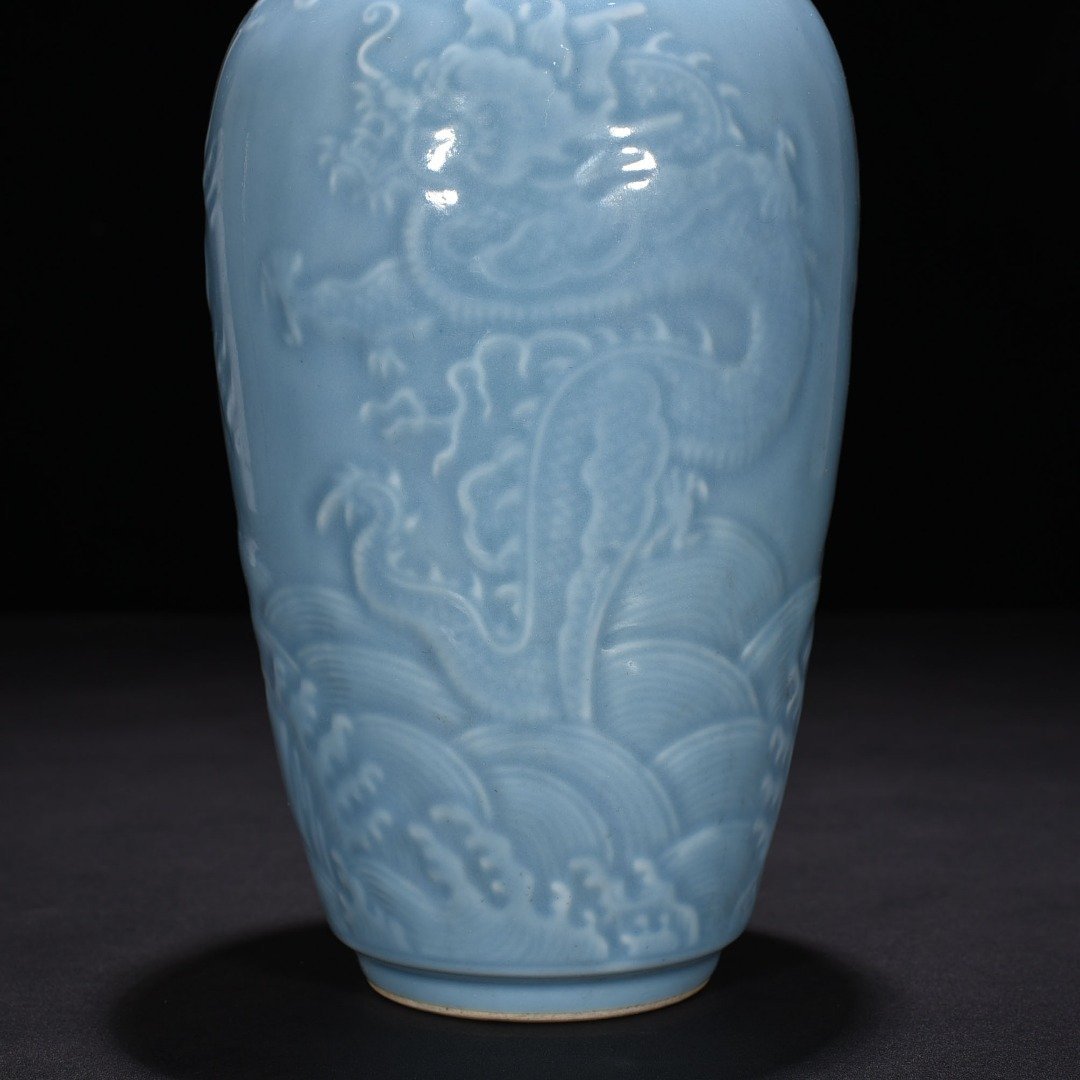 Qing Dynasty Qianlong sky blue glaze engraved dragon pattern vase