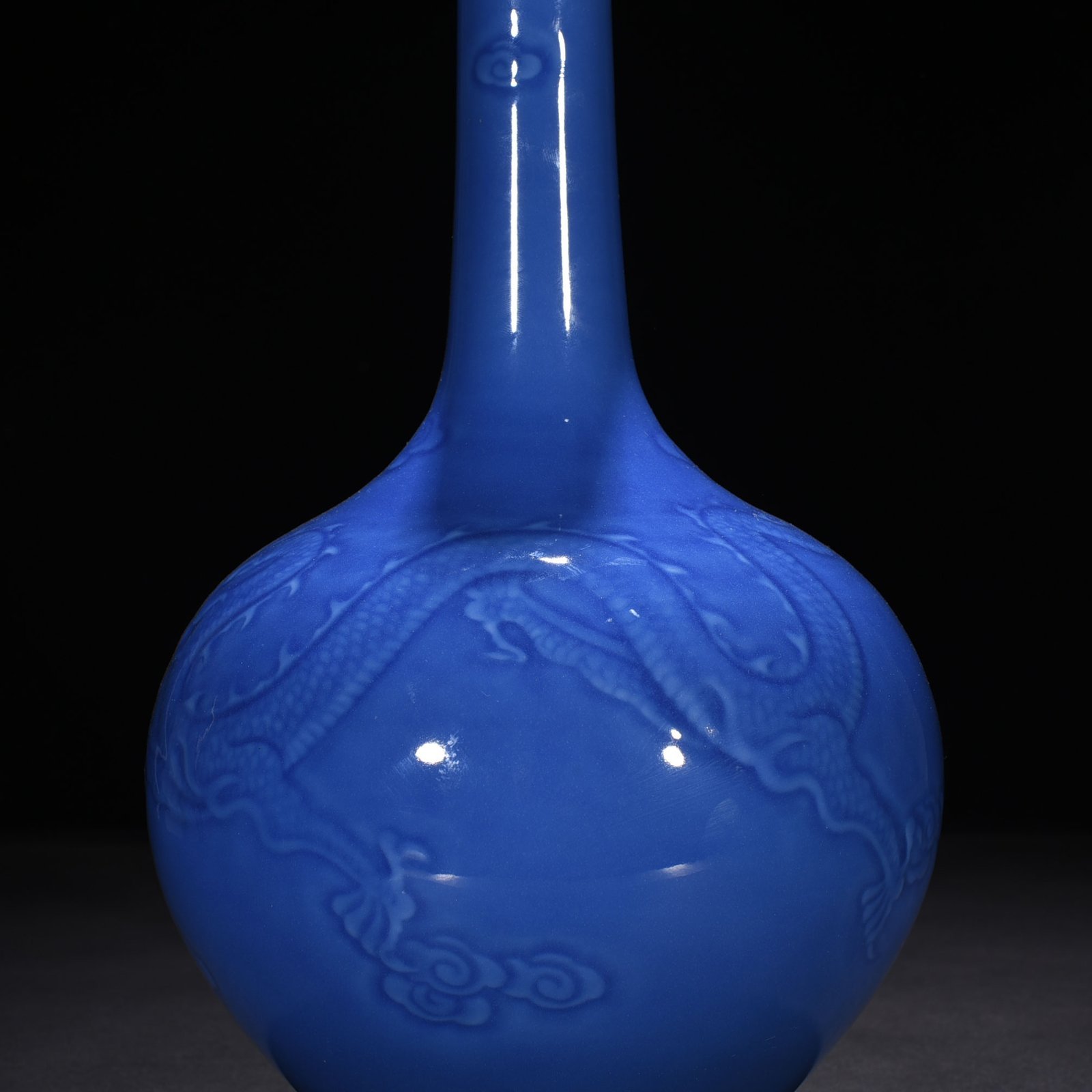 Qing Dynasty Qianlong sky blue glaze engraved dragon pattern bile vase