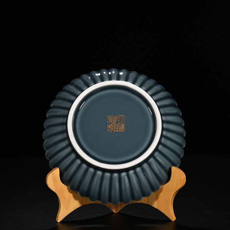 Qing Dynasty Qianlong sky blue glazed chrysanthemum petal dish