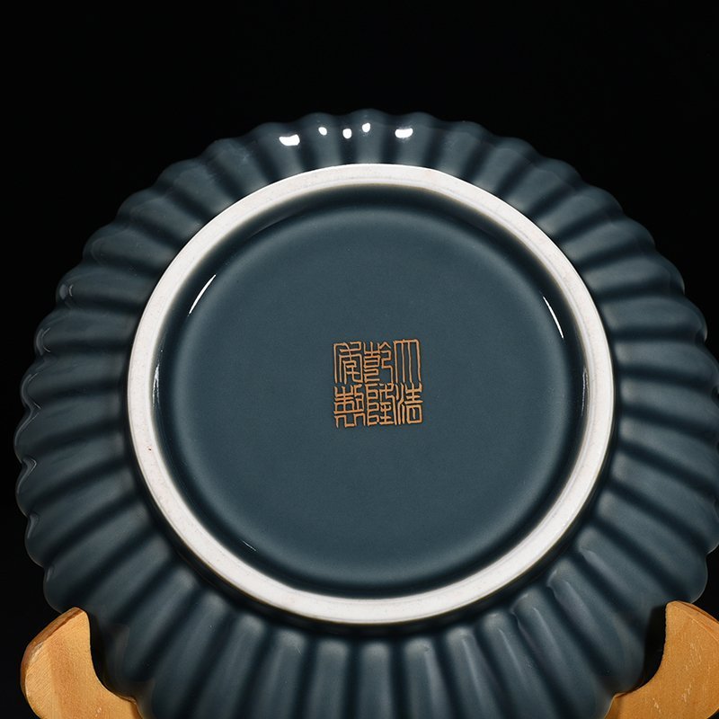 Qing Dynasty Qianlong sky blue glazed chrysanthemum petal dish