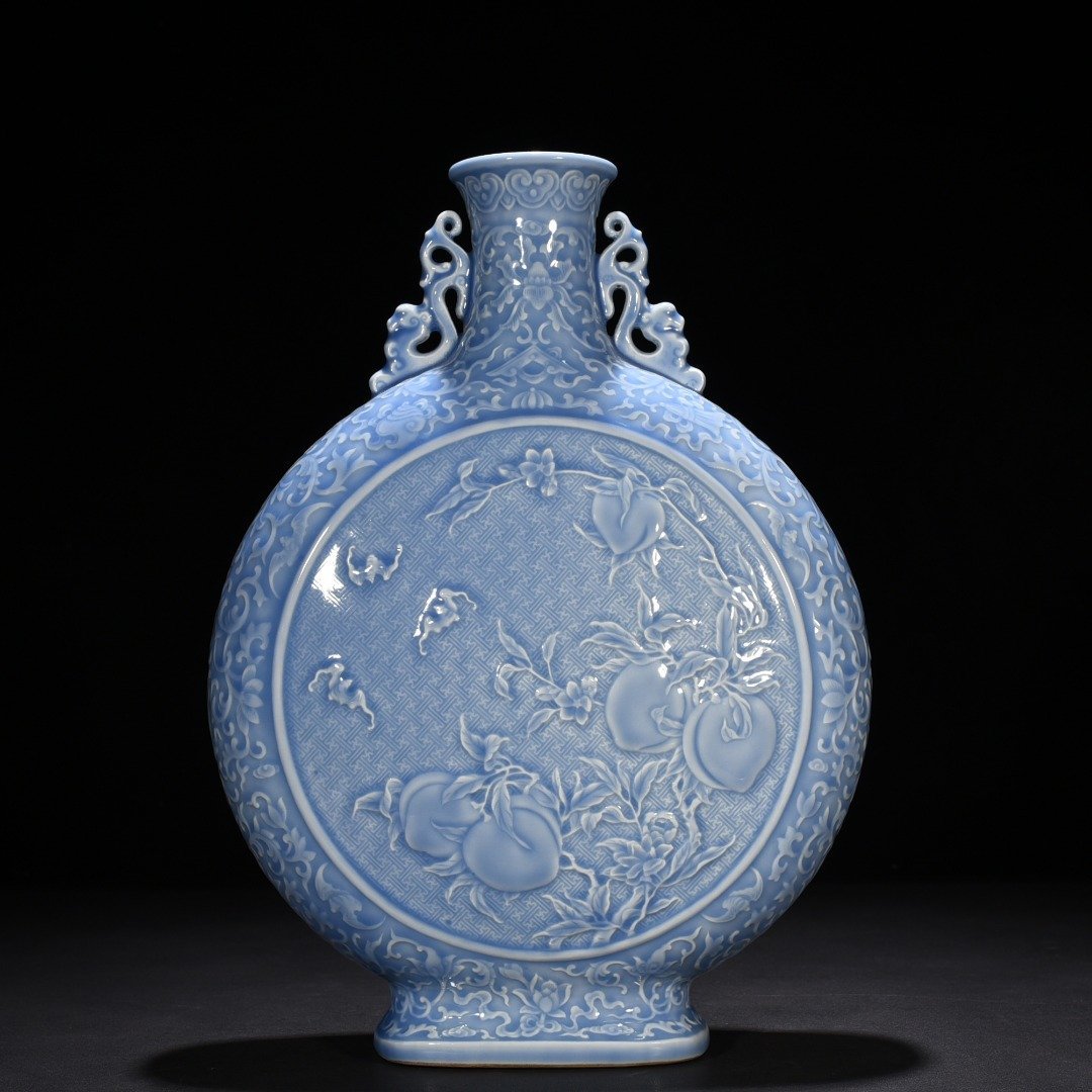 Qing Dynasty Qianlong sky blue glaze carved blessing longevity and many children holding the moon vase