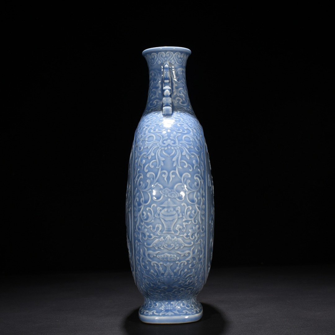 Qing Dynasty Qianlong sky blue glaze carved blessing longevity and many children holding the moon vase
