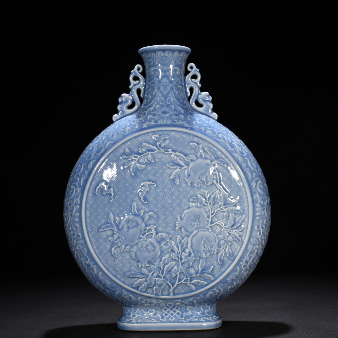 Qing Dynasty Qianlong sky blue glaze carved blessing longevity and many children holding the moon vase