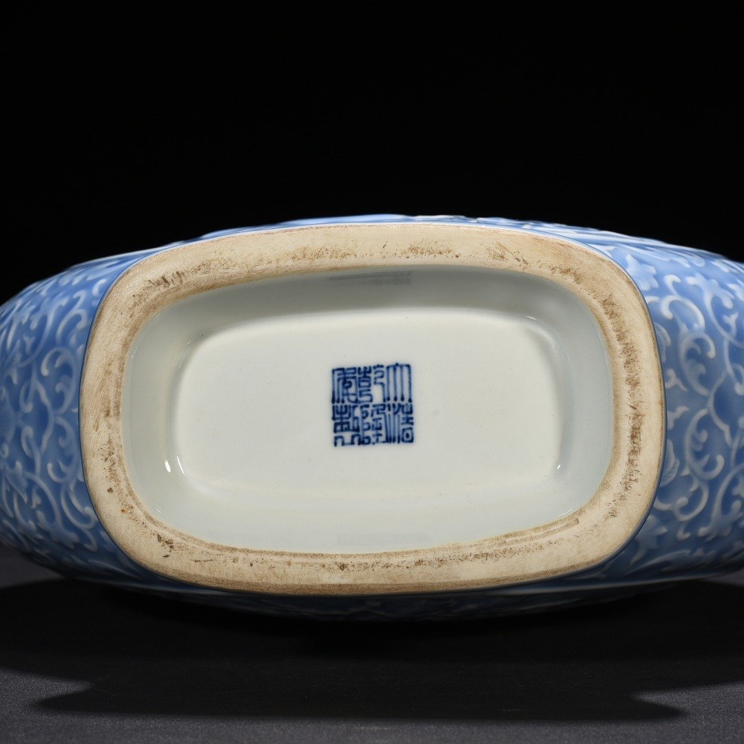 Qing Dynasty Qianlong sky blue glaze carved blessing longevity and many children holding the moon vase