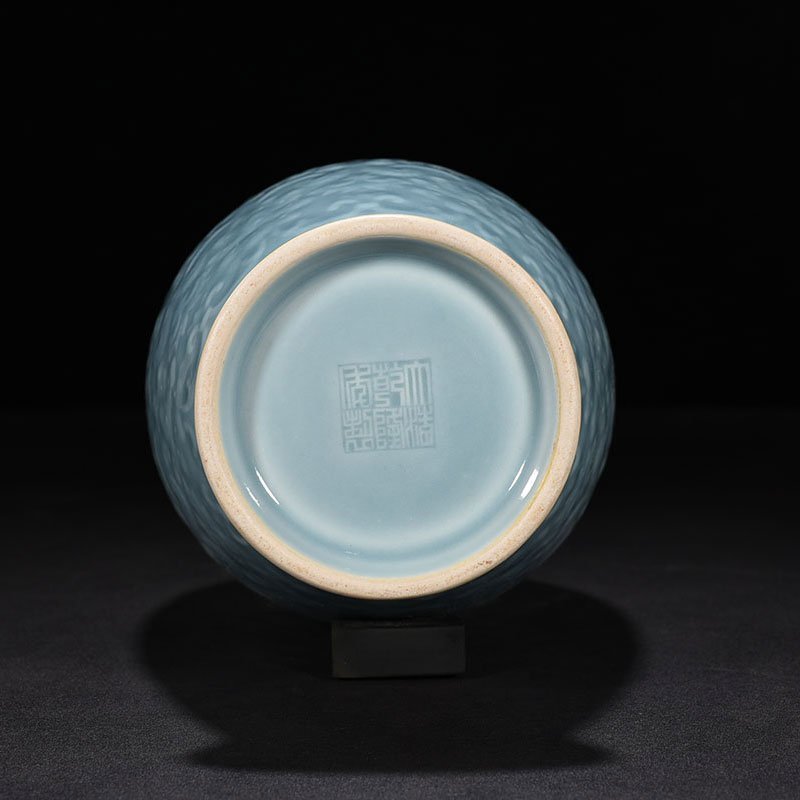 Qing Dynasty Qianlong sky blue glaze carved dish vase with branch and flower pattern