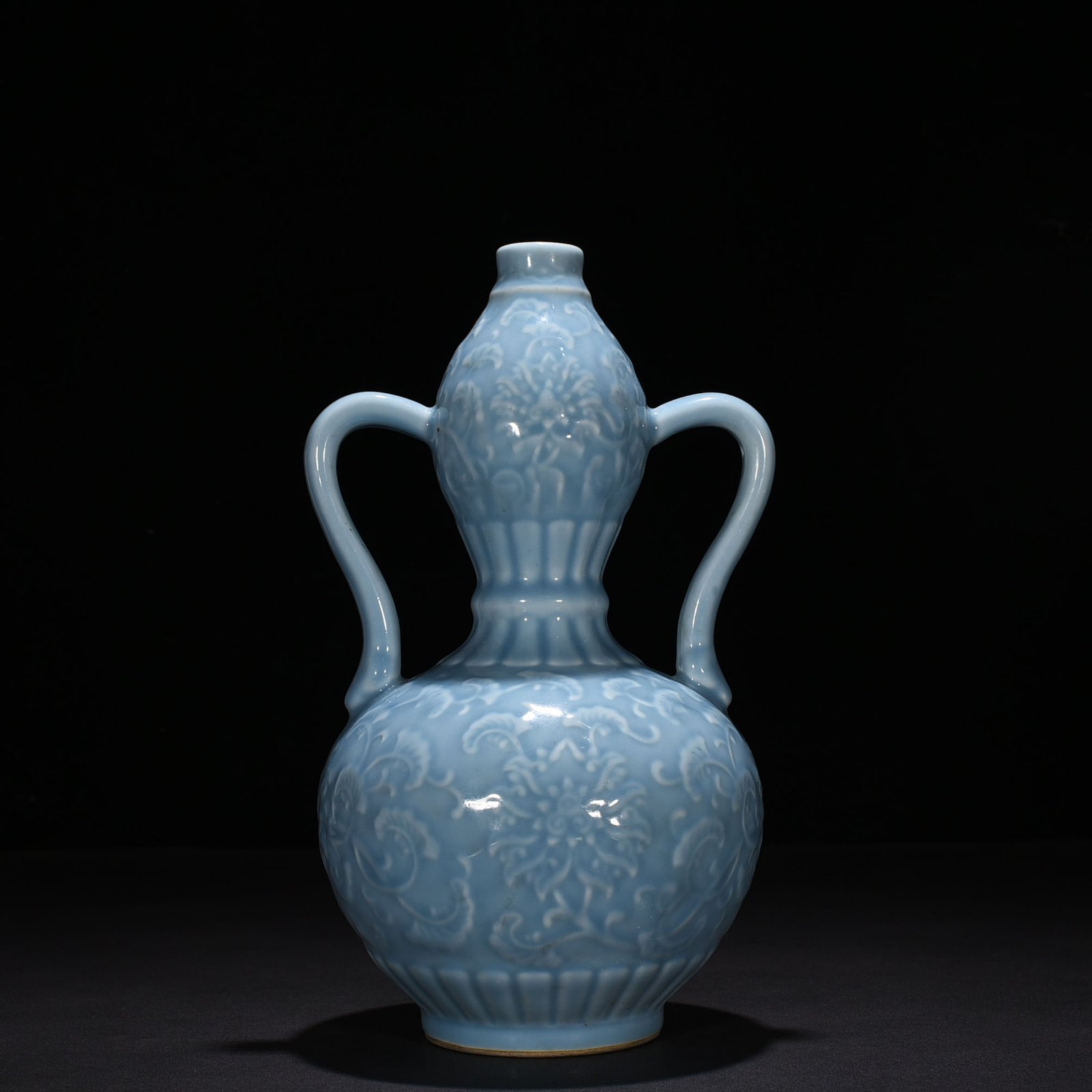 Qing Dynasty Qianlong sky blue glaze carved gourd vase with branches and floral patterns
