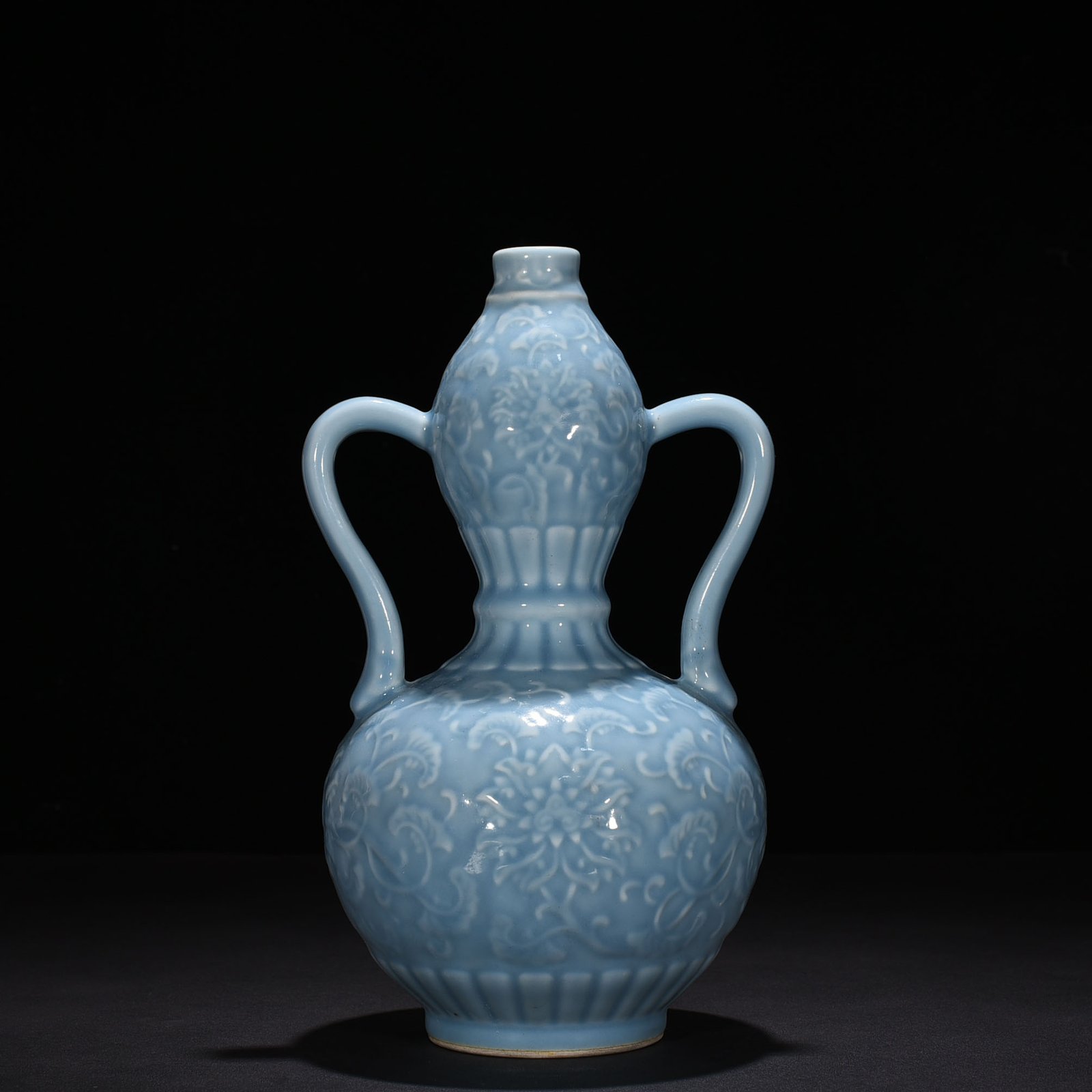 Qing Dynasty Qianlong sky blue glaze carved gourd vase with branches and floral patterns