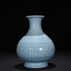 Qing Dynasty Qianlong sky blue glaze carved Taotie pattern jade pot spring vase
