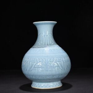 Qing Dynasty Qianlong sky blue glaze carved Taotie pattern jade pot spring vase
