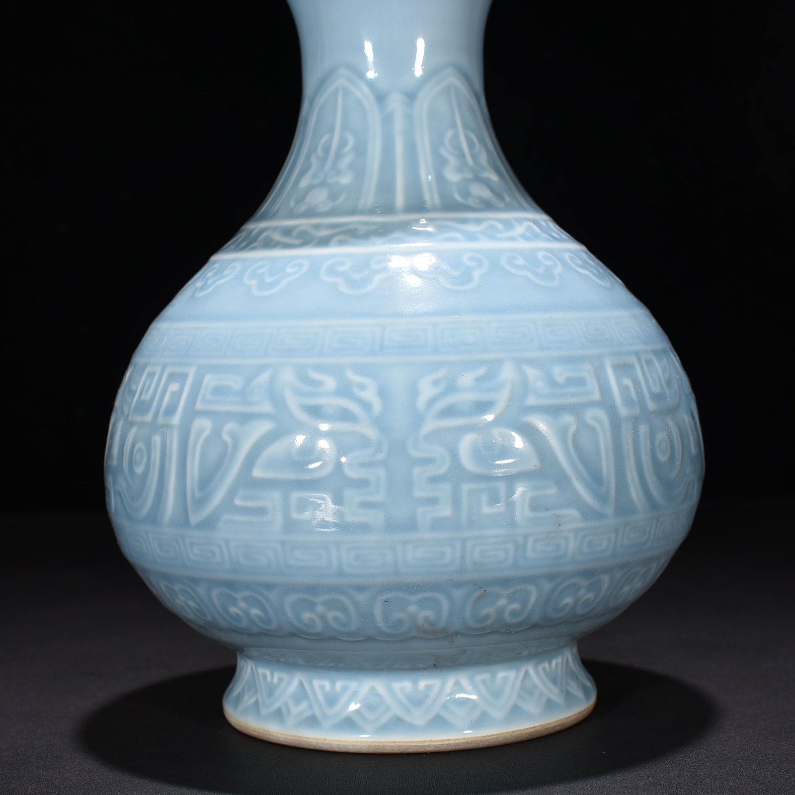 Qing Dynasty Qianlong sky blue glaze carved Taotie pattern jade pot spring vase