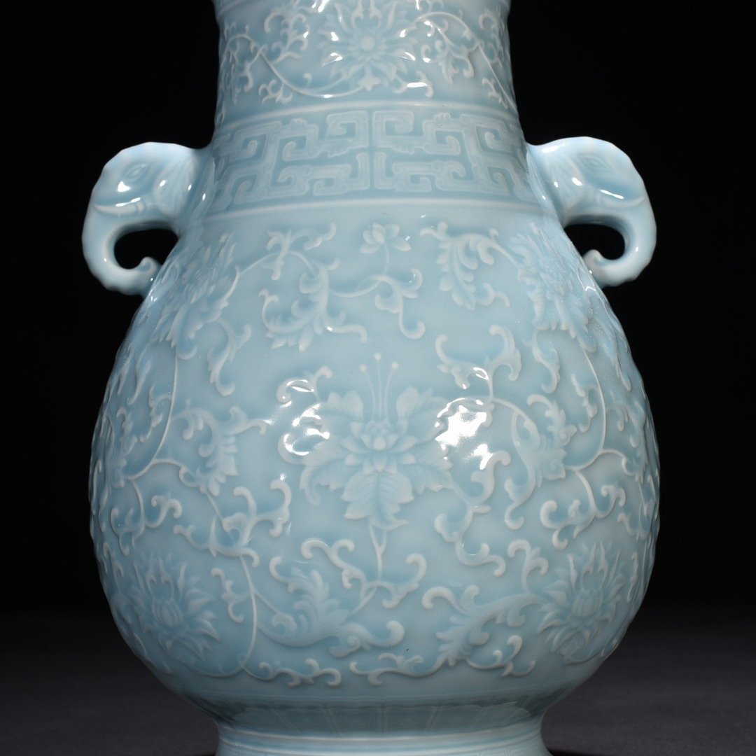 Qing Dynasty Qianlong azure glaze carved elephant ear statue with entangled branches and floral patterns