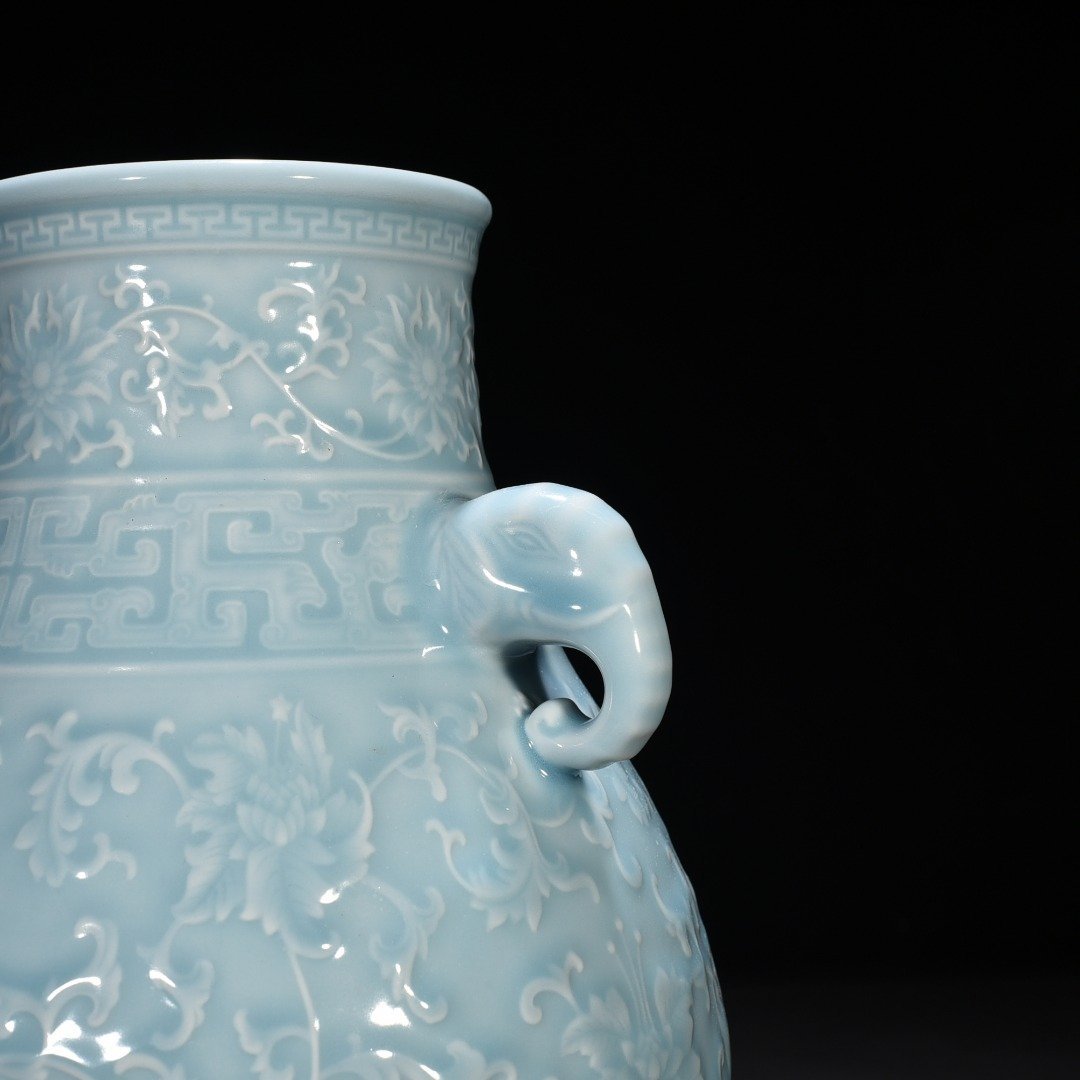 Qing Dynasty Qianlong azure glaze carved elephant ear statue with entangled branches and floral patterns