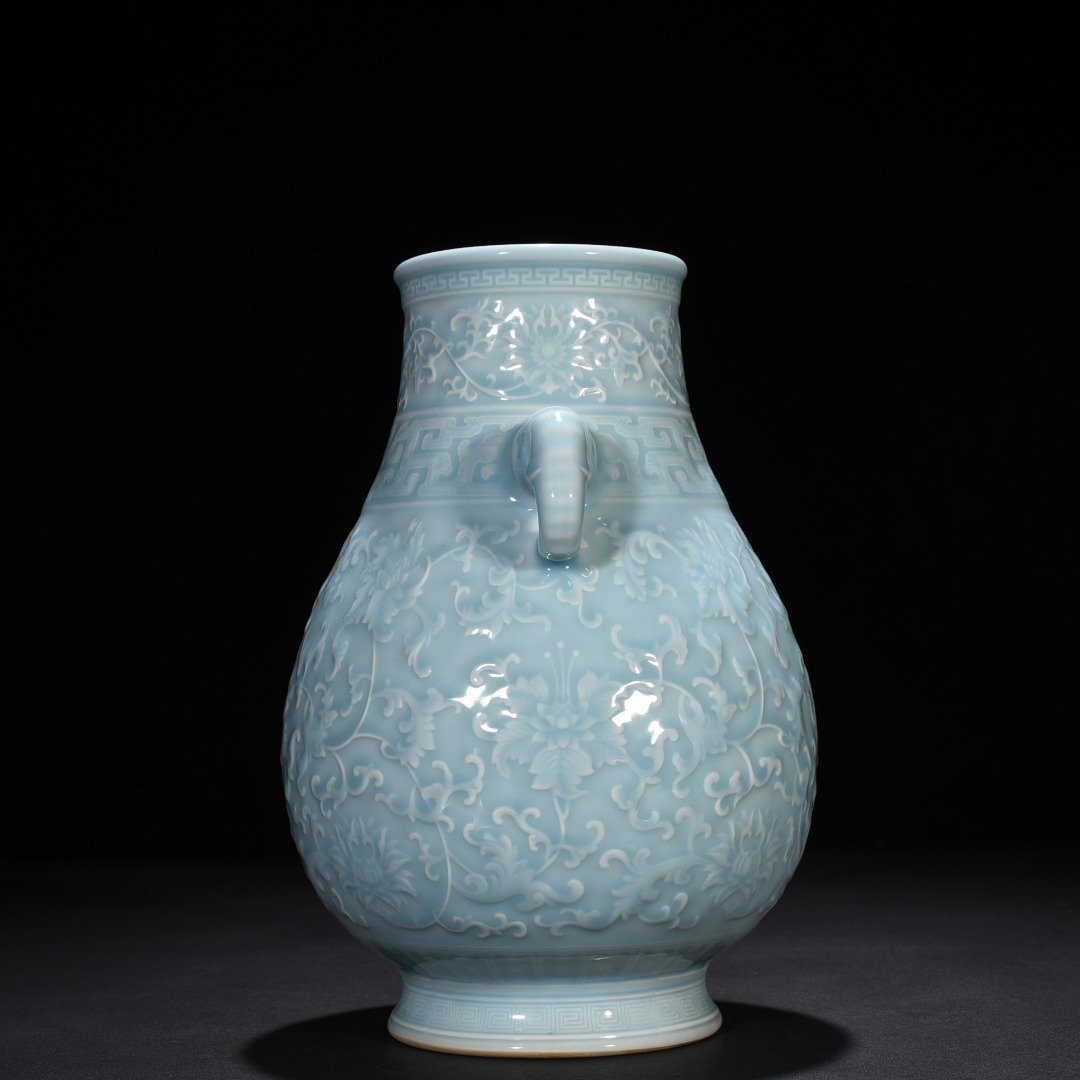 Qing Dynasty Qianlong azure glaze carved elephant ear statue with entangled branches and floral patterns