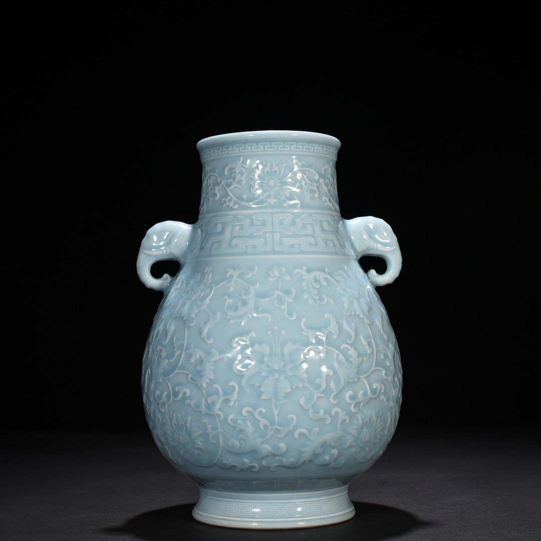 Qing Dynasty Qianlong azure glaze carved elephant ear statue with entangled branches and floral patterns