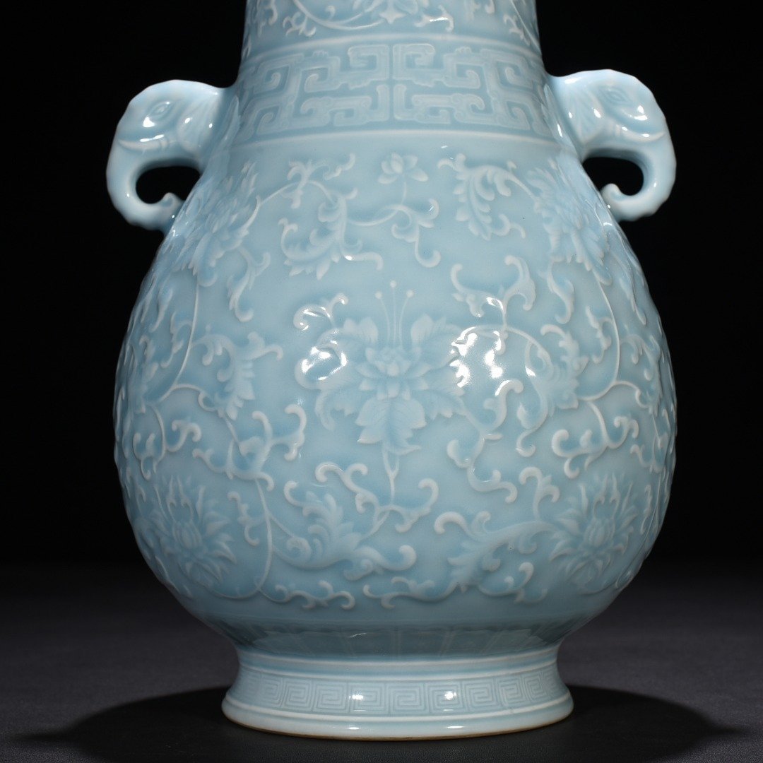 Qing Dynasty Qianlong azure glaze carved elephant ear statue with entangled branches and floral patterns