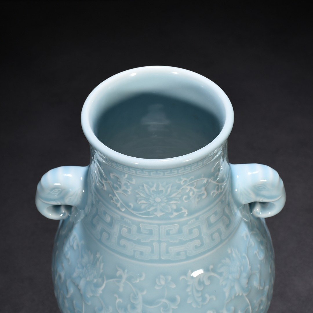 Qing Dynasty Qianlong azure glaze carved elephant ear statue with entangled branches and floral patterns