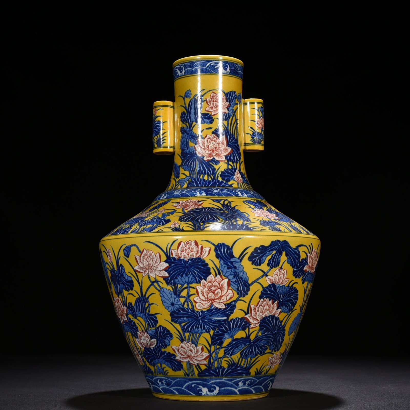 Qing Dynasty Qianlong delicate yellow glaze blue and white underglaze red lotus pattern through-ear vase