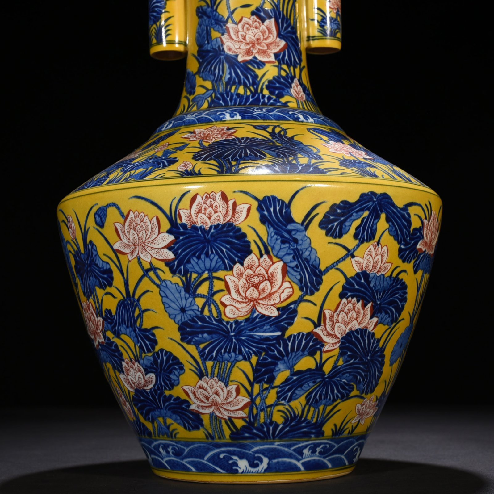 Qing Dynasty Qianlong delicate yellow glaze blue and white underglaze red lotus pattern through-ear vase