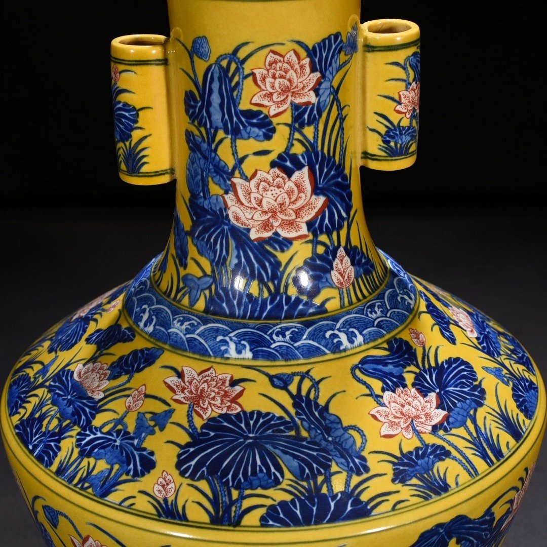 Qing Dynasty Qianlong delicate yellow glaze blue and white underglaze red lotus pattern through-ear vase