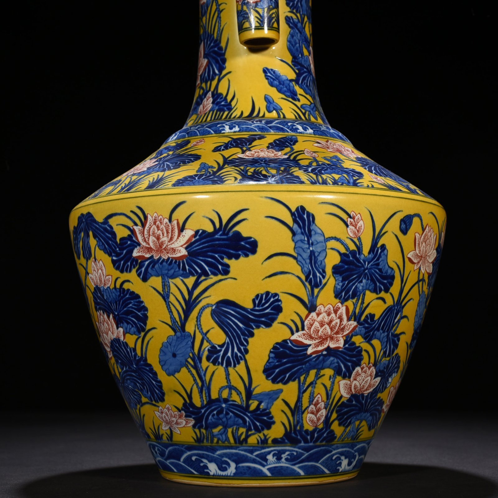 Qing Dynasty Qianlong delicate yellow glaze blue and white underglaze red lotus pattern through-ear vase