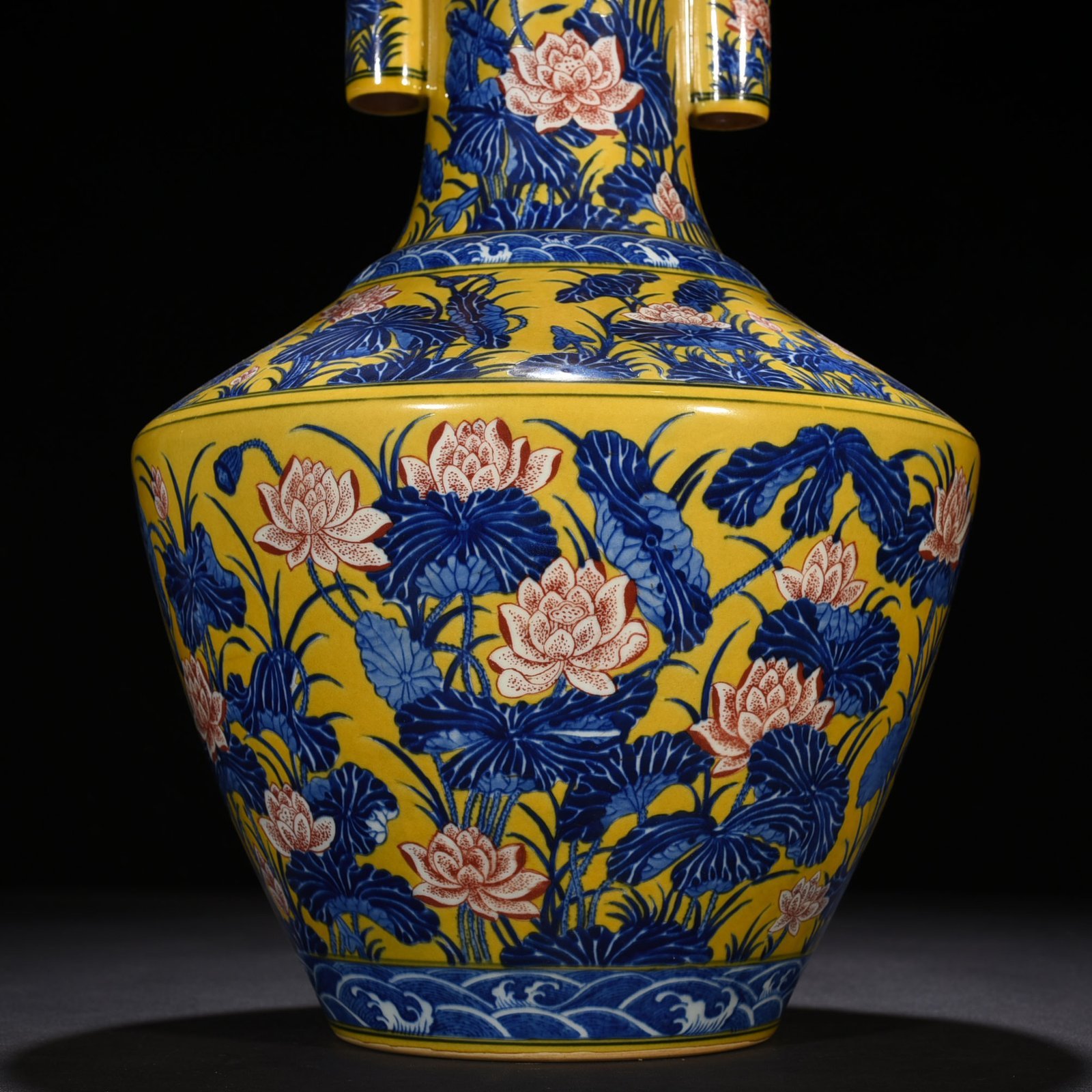 Qing Dynasty Qianlong delicate yellow glaze blue and white underglaze red lotus pattern through-ear vase