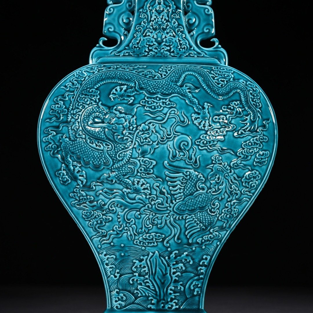 Qing Dynasty Qianlong peacock blue glaze flat vase with dragon and phoenix patterns