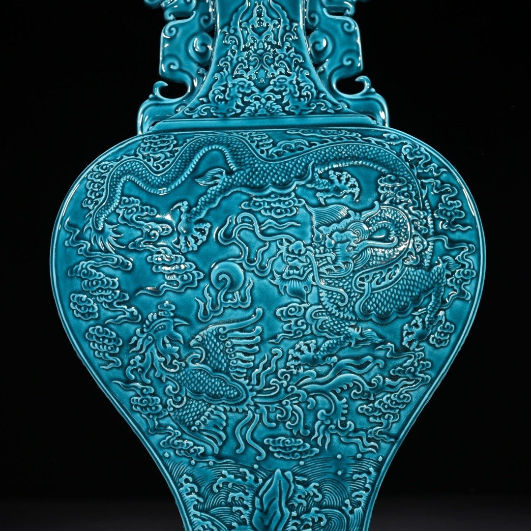 Qing Dynasty Qianlong peacock blue glaze flat vase with dragon and phoenix patterns