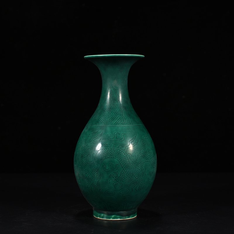 Qing Dynasty Qianlong peacock blue glaze jade pot spring vase with carved dragon pattern