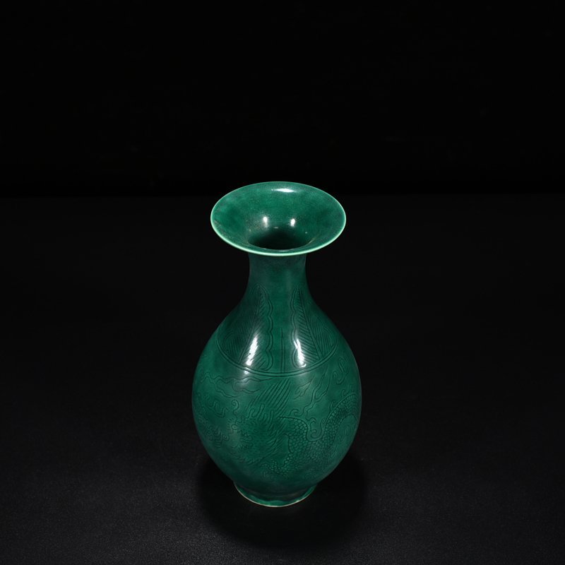 Qing Dynasty Qianlong peacock blue glaze jade pot spring vase with carved dragon pattern