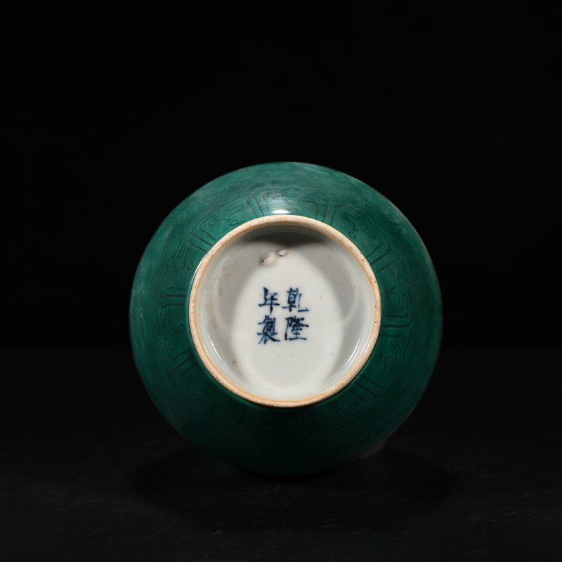 Qing Dynasty Qianlong peacock blue glaze jade pot spring vase with carved dragon pattern