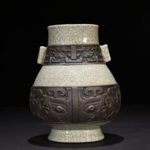 Qing Dynasty Qianlong official kiln carved Taotie pattern through-ear vase